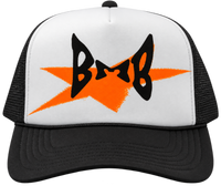 BMB trucker hat with black mesh, white front panel, orange graphic and black logo